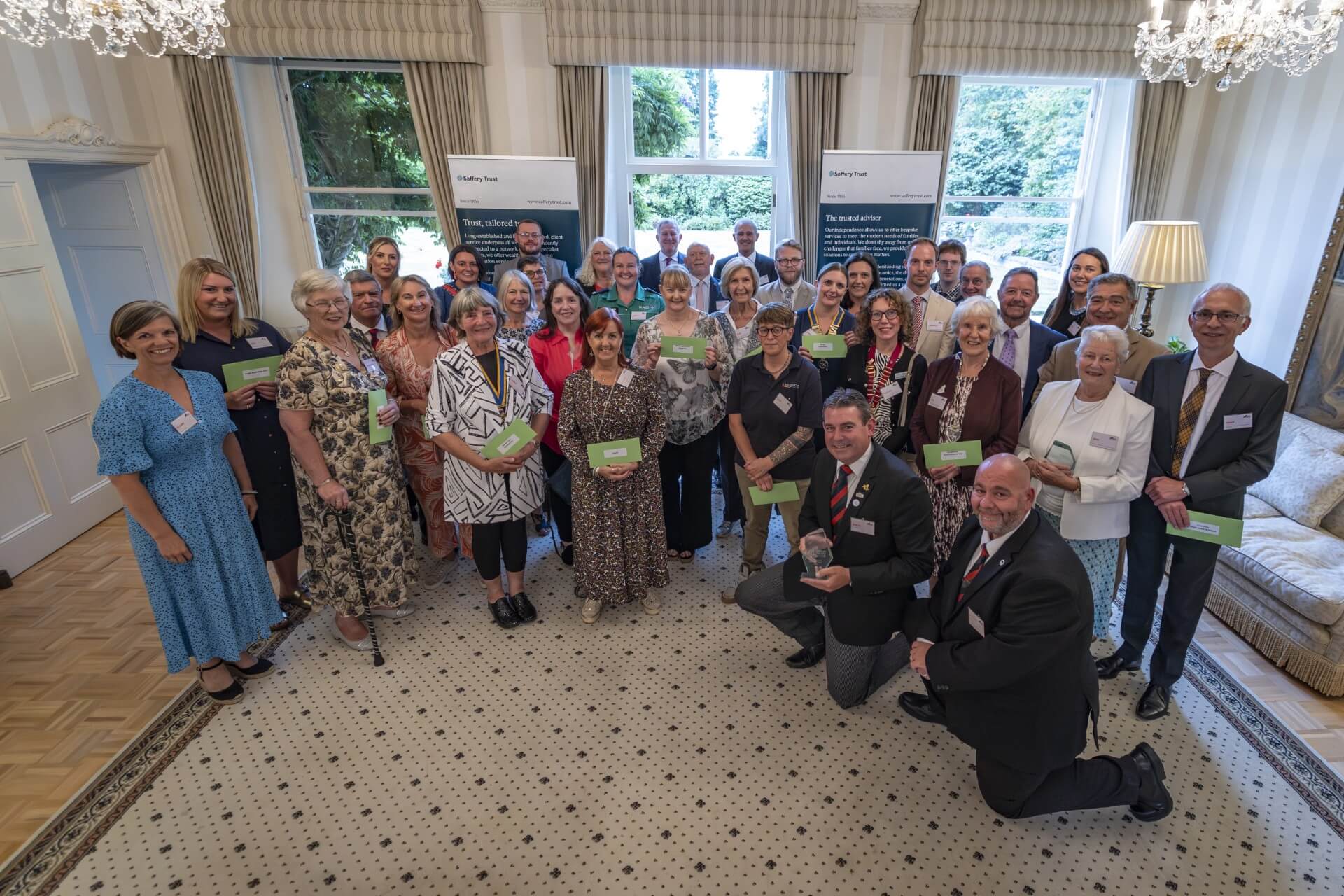 Charity representatives welcomed to Government House to receive their grants.