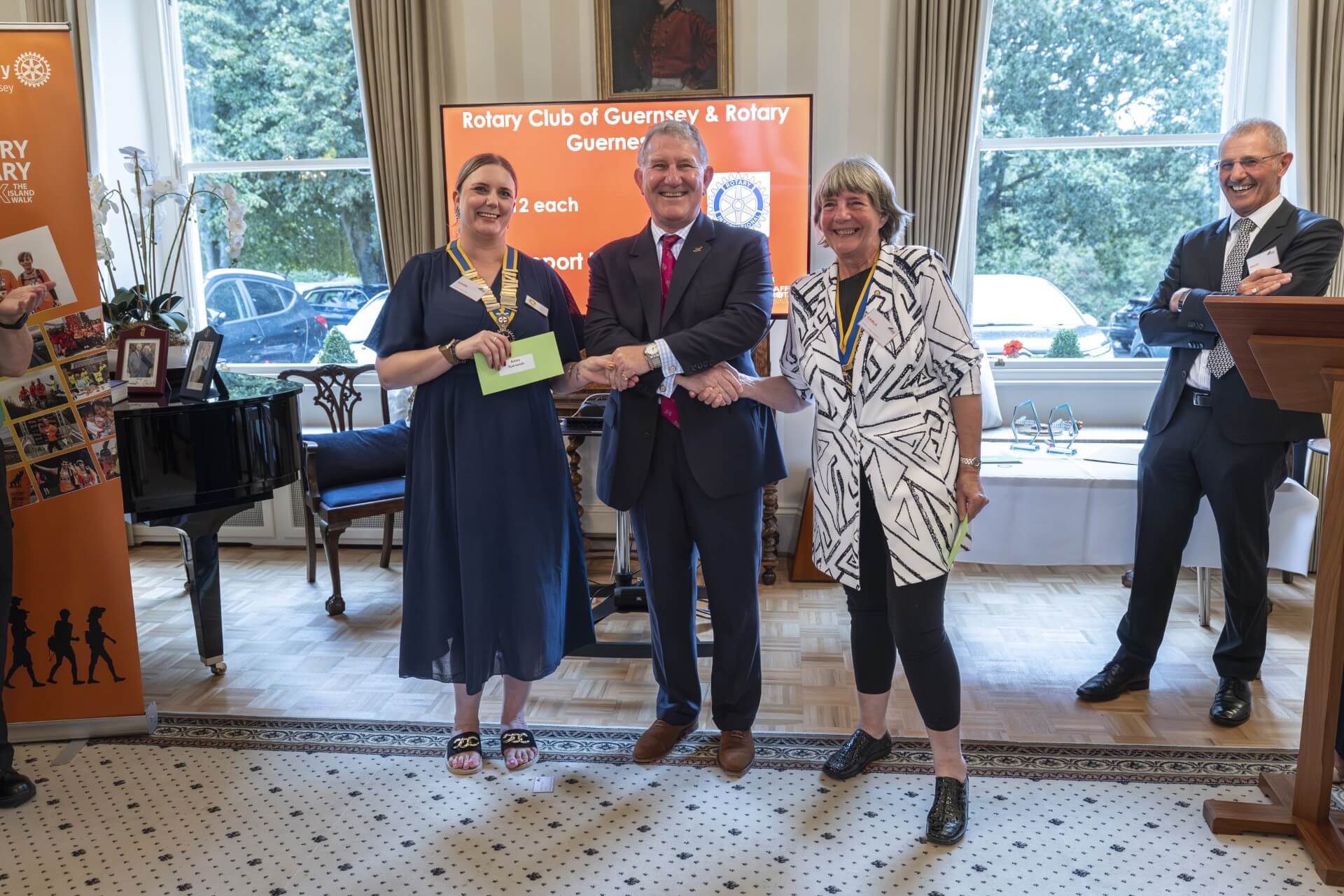 Presidents of Guernsey’s two Rotary Clubs receiving thanks and congratulations from the Lt Governor